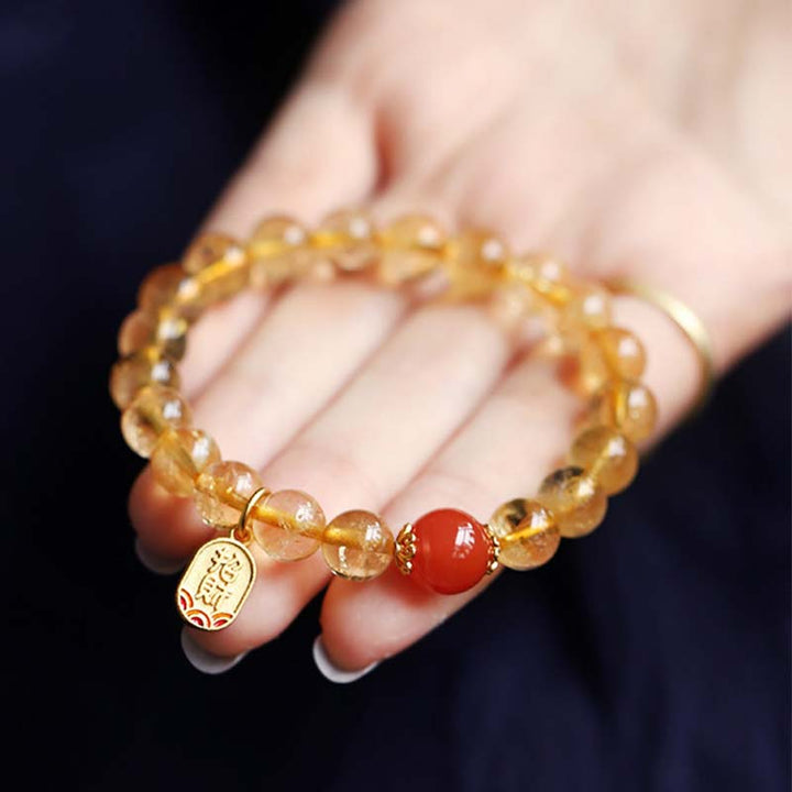Braccialetto con ciondolo della fortuna in agata rossa e citrino Buddha Stones