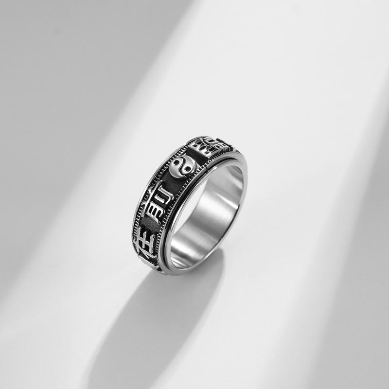 Anello girevole in acciaio al titanio con parole in equilibrio e calma