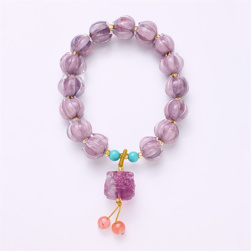 Braccialetto dell'illuminazione con ciondolo leone danzante avorio, perline di vetro Liuli, motivo loto, fluorite e Buddha Stones