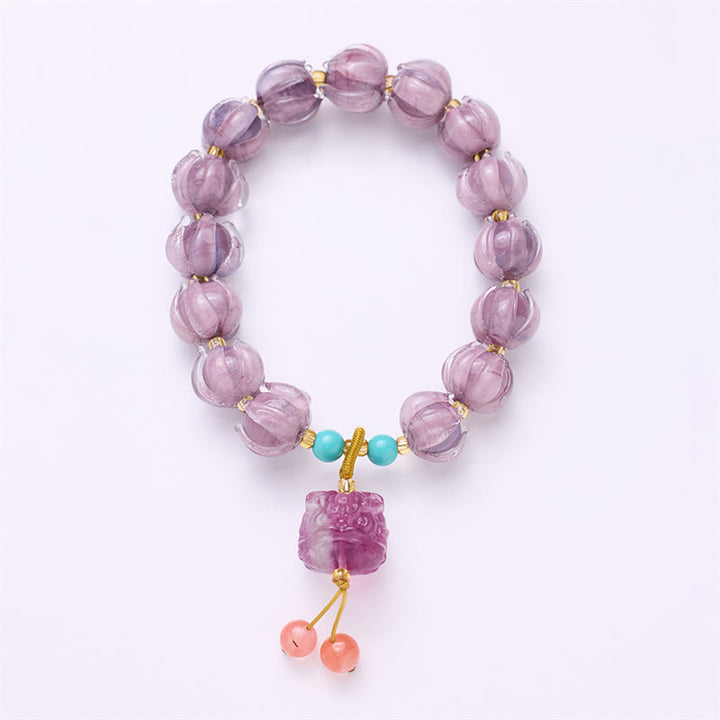 Braccialetto dell'illuminazione con ciondolo leone danzante avorio, perline di vetro Liuli, motivo loto, fluorite e Buddha Stones