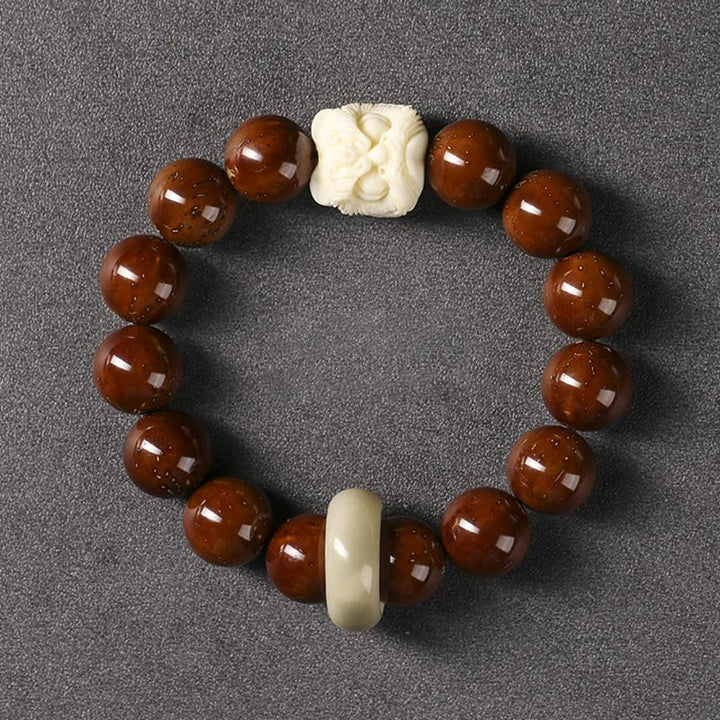 Braccialetto della saggezza del leone danzante dei semi di Bodhi viola Buddha Stones