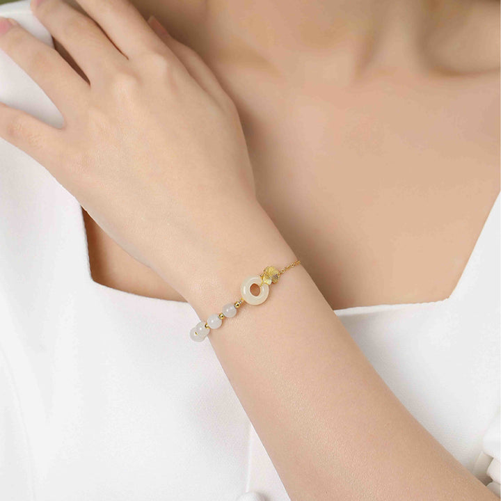 Braccialetto della fortuna con foglia di ginkgo e fibbia della pace in argento sterling 925 con Buddha Stones e giada bianca Hetian