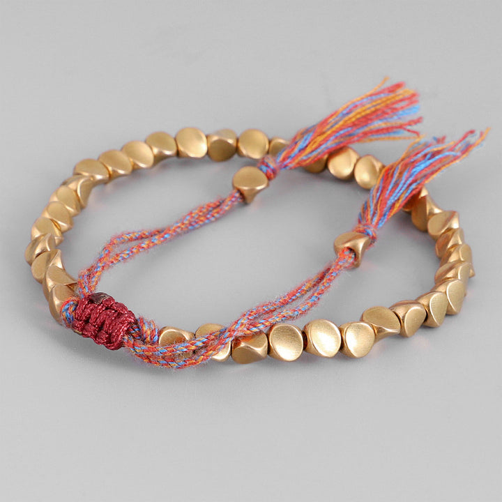 Braccialetto portafortuna con perline di rame tibetano Buddha Stones