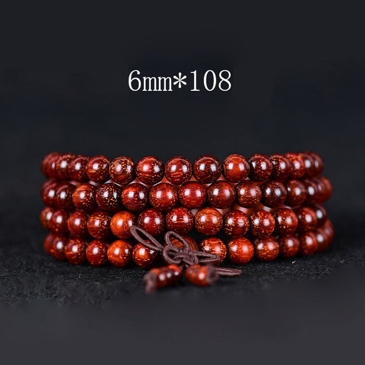 Braccialetto di equilibrio in legno di sandalo rosso con foglia piccola tibetana Buddha Stones