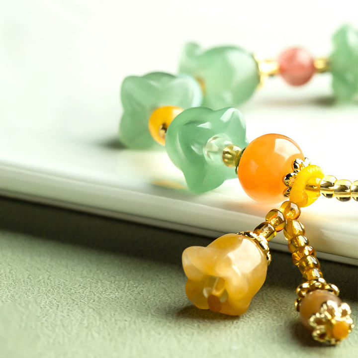 Braccialetto della fortuna con fiore di magnolia, avventurina verde Buddha Stones