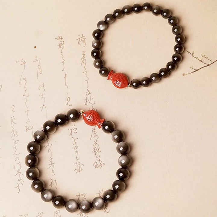 Braccialetto di protezione lenitiva con pesce koi, ossidiana, cinabro, argento naturale e Buddha Stones