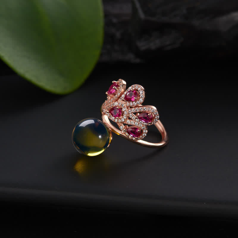 Collana con ciondolo e anello in ambra con pavone e amore e fortuna
