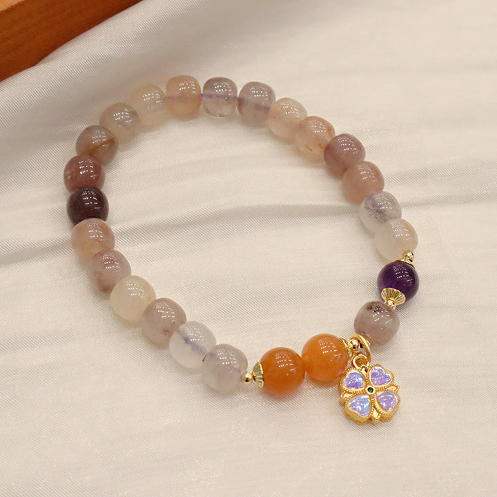 Braccialetto di perline con ciondolo a forma di fiore viola dorato naturale di seta Buddha Stones