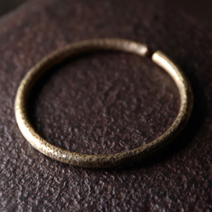 Bracciale regolabile con polsino in rame e design rustico Buddha Stones
