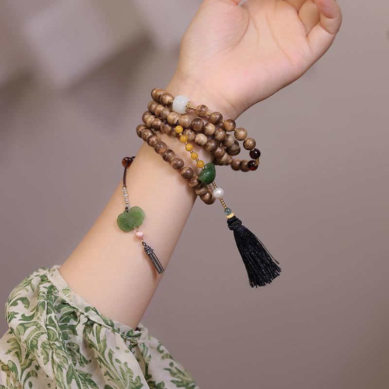 Braccialetto con ciondolo Ruyi in lingotto di giada ambrato naturale con Buddha Stones agarwood