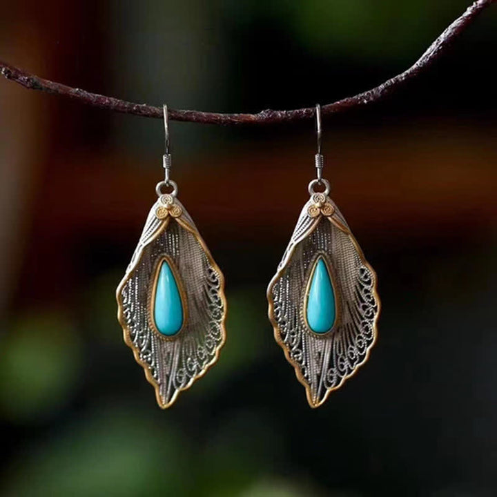 Orecchini pendenti con motivo a foglia di Bodhi in argento sterling 925 con Buddha Stones e turchese