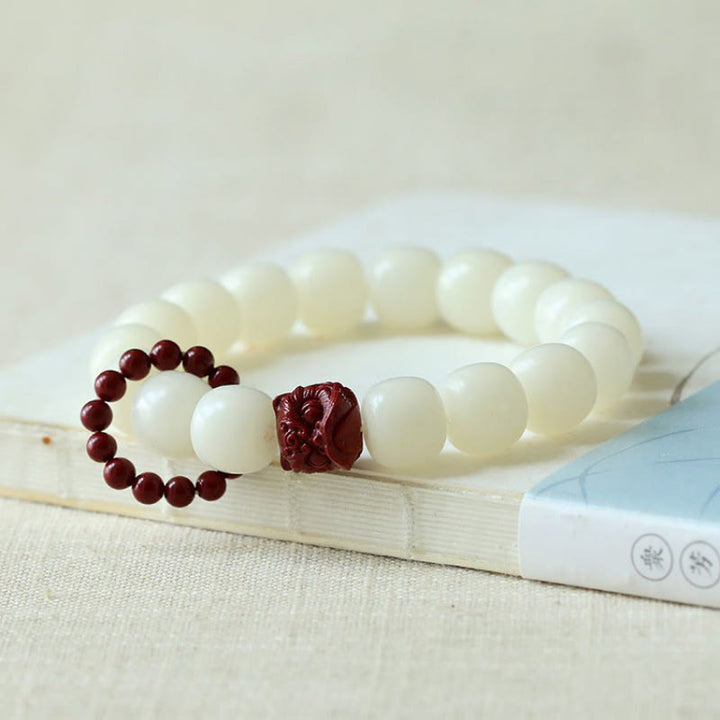 Buddha Stones Semi di Bodhi naturale Cinabro Leone danzante Charm Saggezza Armonia Polso Mala
