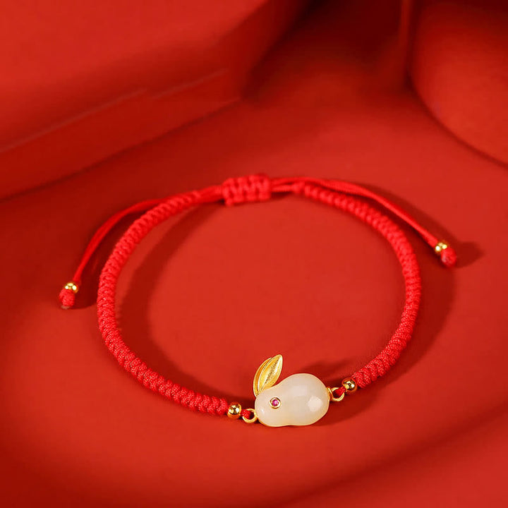 Braccialetto di protezione con corda rossa e giada bianca Hetian dell'anno del coniglio in argento sterling 925 Buddha Stones