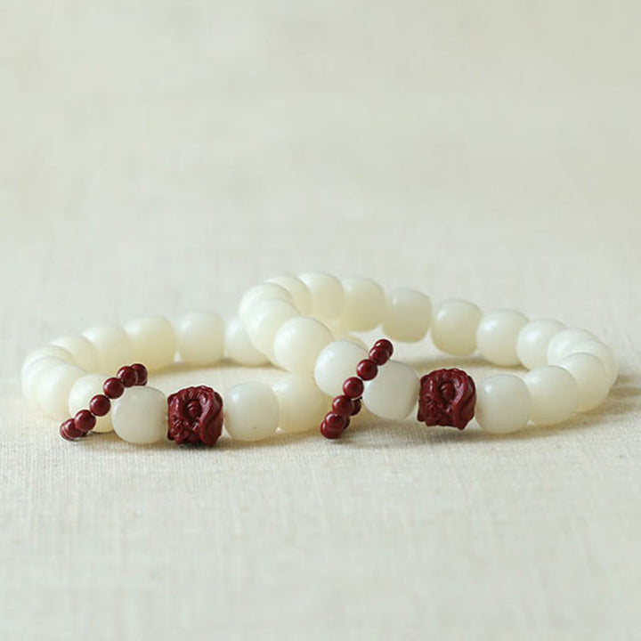 Buddha Stones Semi di Bodhi naturale Cinabro Leone danzante Charm Saggezza Armonia Polso Mala