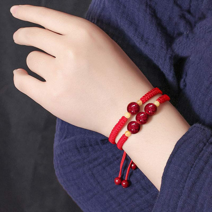 Braccialetto rosso con corda e cinabro per bambini, con Buddha Stones