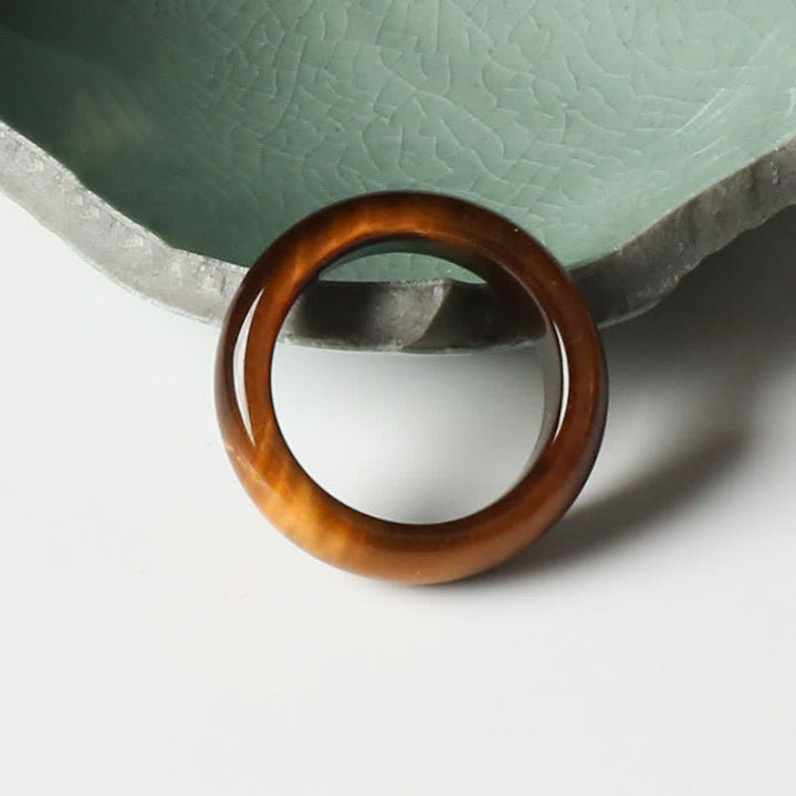 Anello di protezione della forza della pietra dell'occhio di tigre Buddha Stones
