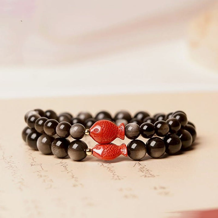 Braccialetto di protezione lenitiva con pesce koi, ossidiana, cinabro, argento naturale e Buddha Stones