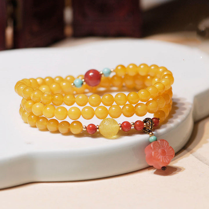 Collana con ciondolo a forma di fiore in ambra curativa e bilanciata