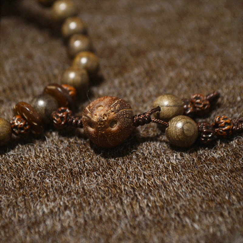 Bracciale Mala con ciondolo di protezione in legno di sandalo tibetano Buddha Stones