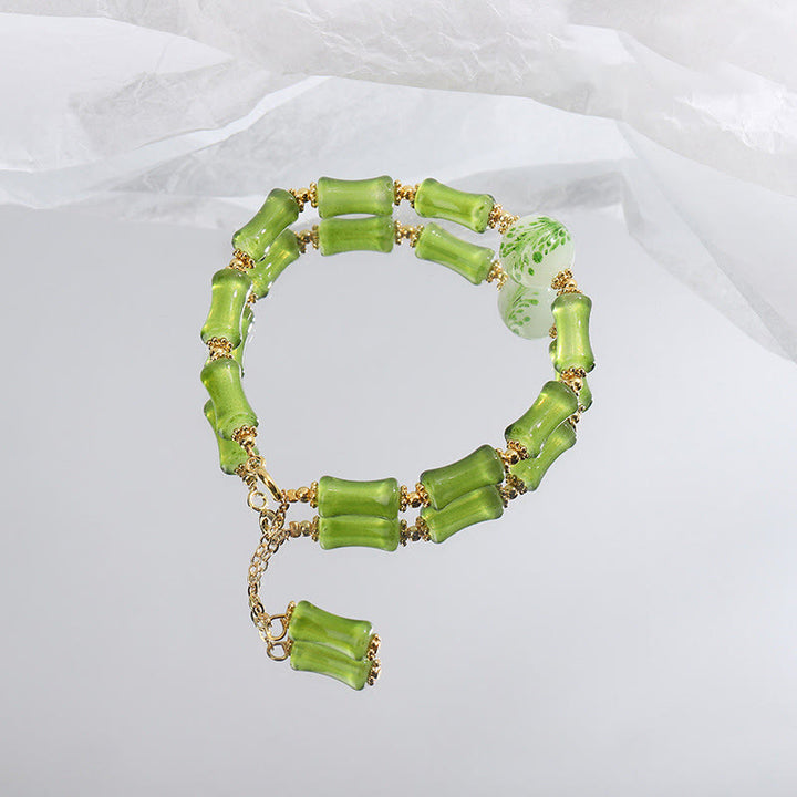 Bracciale a catena della ricchezza in agata muschiata con motivo in bambù verde Buddha Stones Liuli