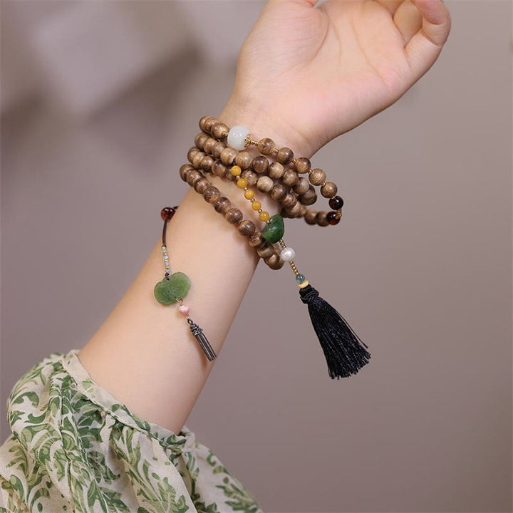 Braccialetto con ciondolo Ruyi in lingotto di giada ambrato naturale con Buddha Stones agarwood