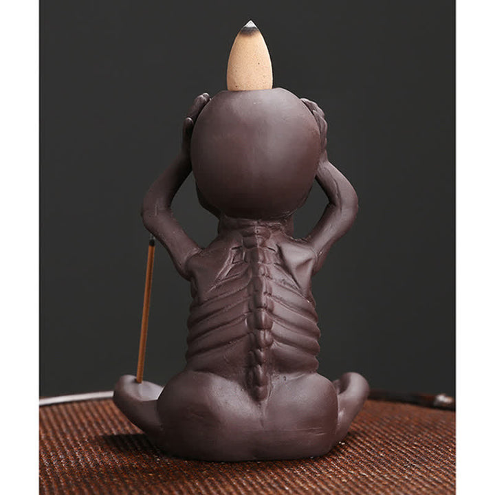 Buddha Stones Piccolo teschio Fantasma Argilla viola Fontana di fumo a riflusso Bruciatore di incenso della pace Decorazione