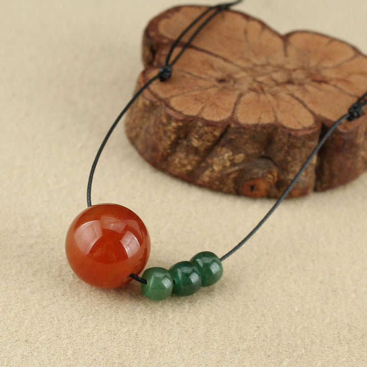 Buddha Stones Agata rossa Avventurina verde Perline di semi di Bodhi verde Collana con ciondolo in corda di cuoio calmo