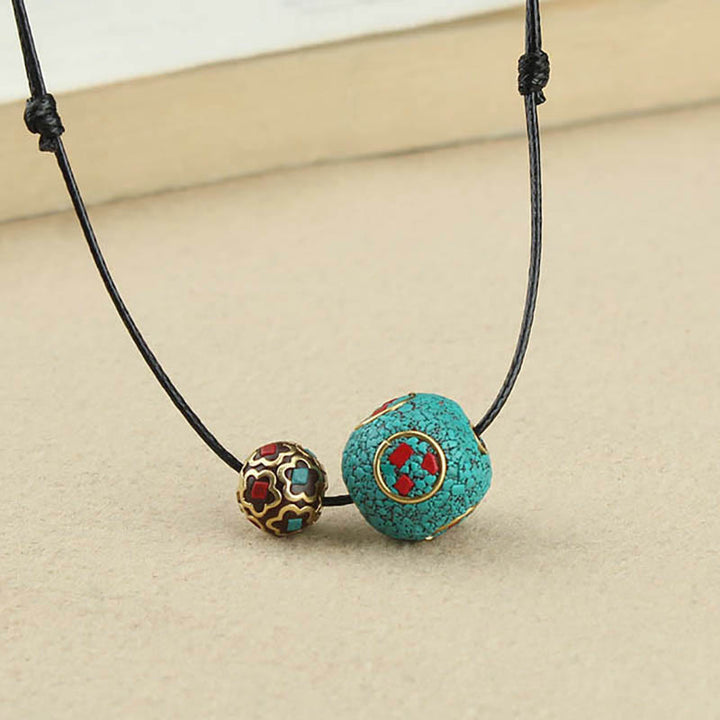 Collana con ciondolo con doppia perla turchese tibetana Buddha Stones, protezione e forza