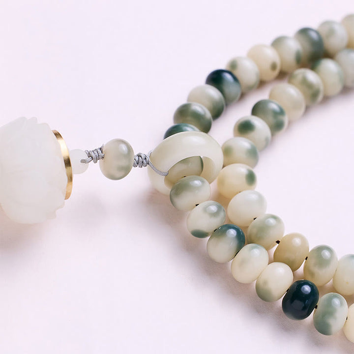 Buddha Stones naturali 108 perle Mala Bodhi Seed Lotus inciso braccialetto di saggezza nappa