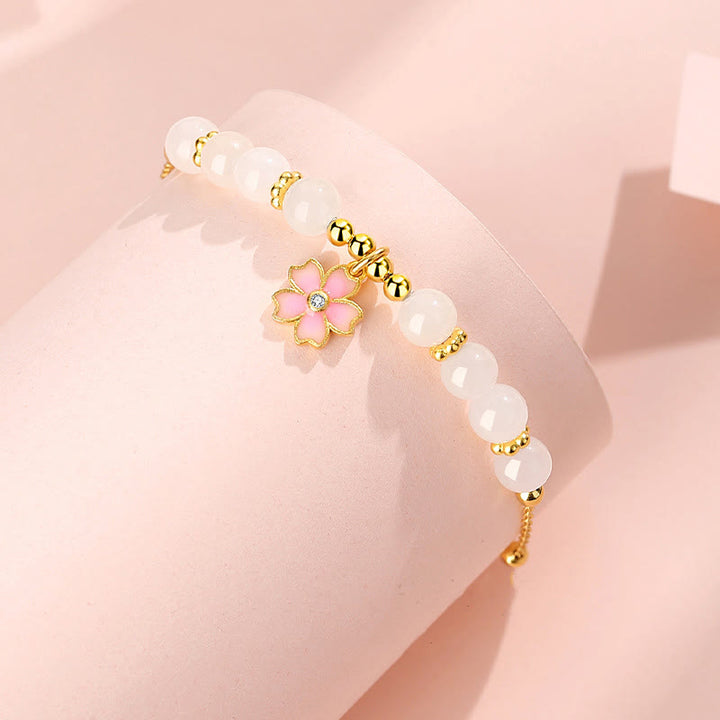 Braccialetto di protezione in giada bianca Hetian con fiori di ciliegio in argento sterling 925 Buddha Stones