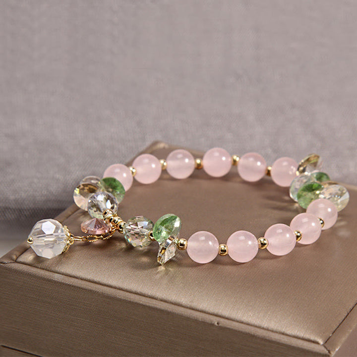 Braccialetto con ciondolo di pace in cristallo rosa con occhio di gatto Buddha Stones