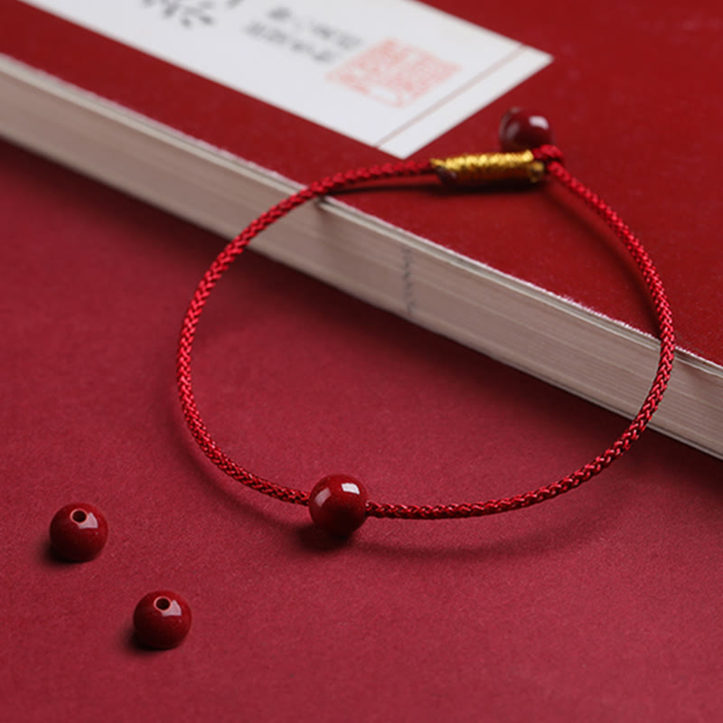 Braccialetto di corda rossa con benedizione in agata rossa naturale e cinabro Buddha Stones