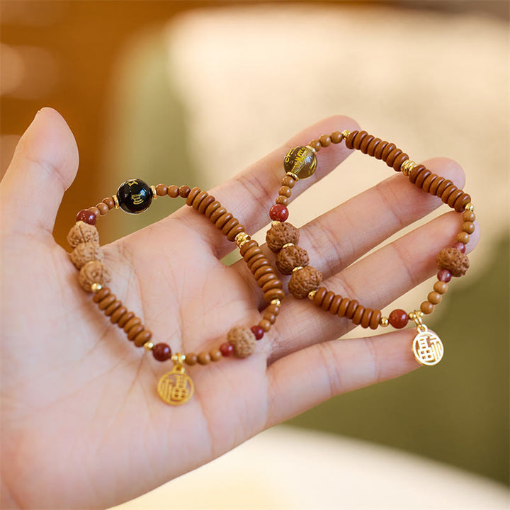 Buddha Stones Semi di Bodhi Tibetano Onice Nero Quarzo Fumé Om Mani Padme Hum Fu Carattere Bracciale Ricchezza