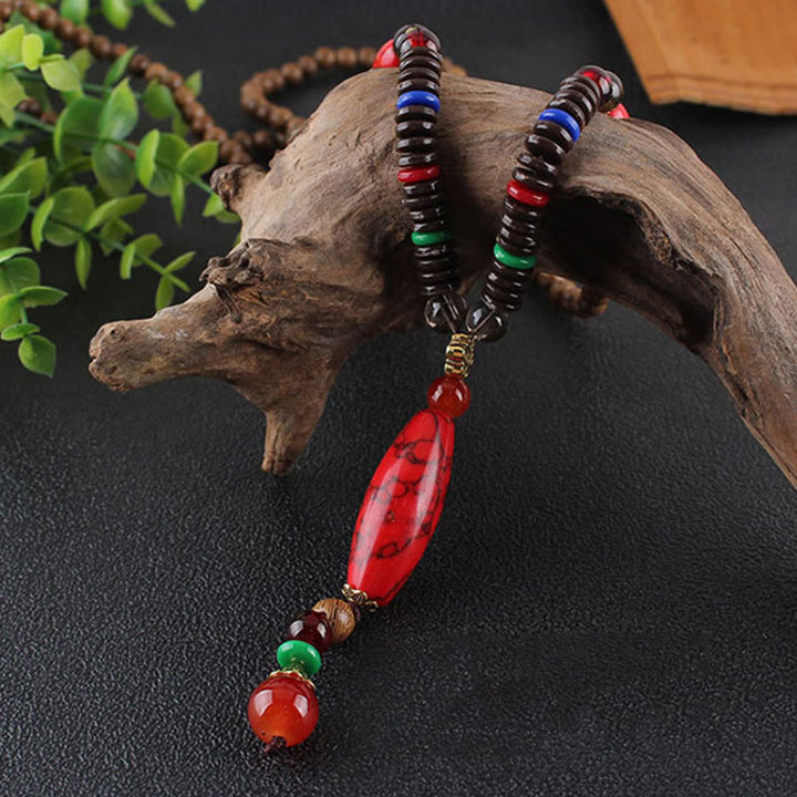 Collana con ciondolo in pietra turchese, pietra di legno di wenge, protezione e calma Buddha Stones
