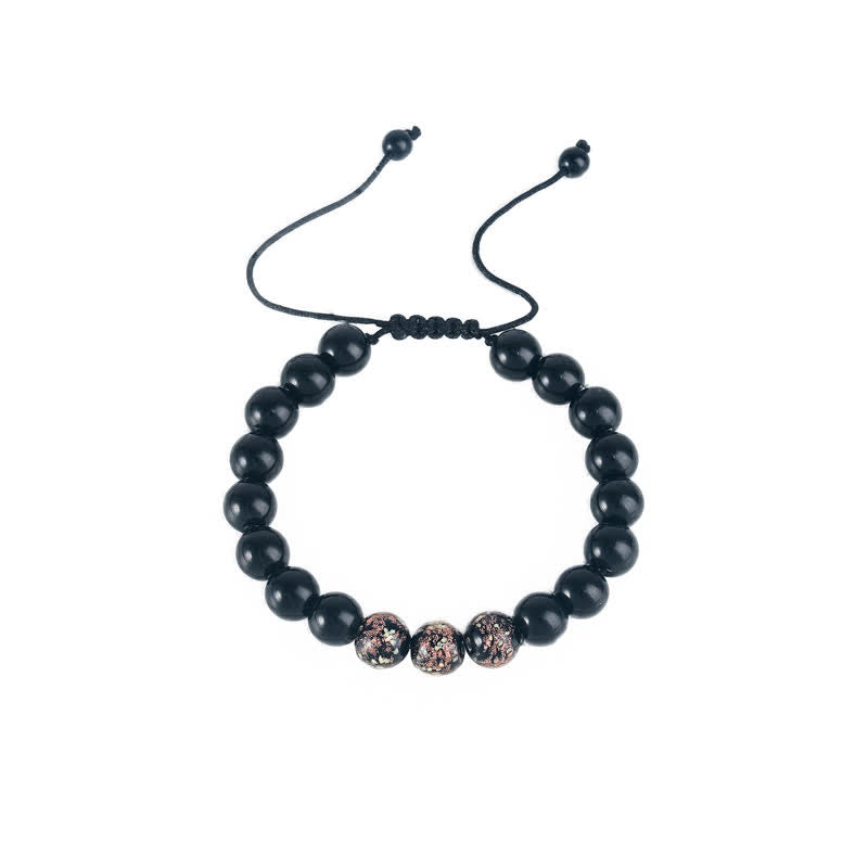 Braccialetto di forza in pietra luminosa con ossidiana nera Buddha Stones