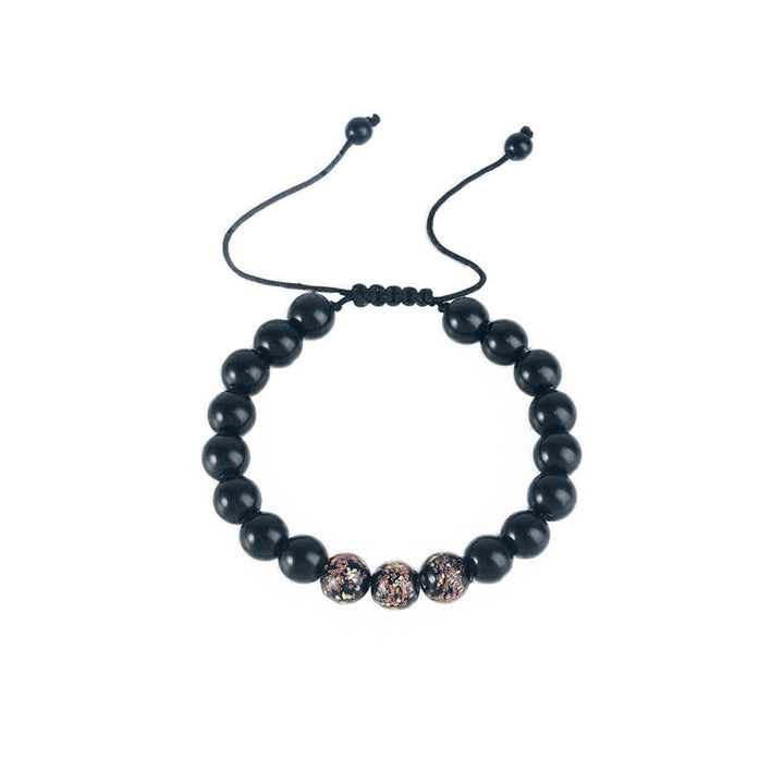 Braccialetto di forza in pietra luminosa con ossidiana nera Buddha Stones