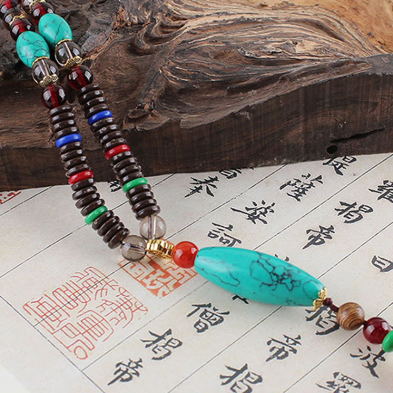 Collana con ciondolo in pietra turchese, pietra di legno di wenge, protezione e calma Buddha Stones