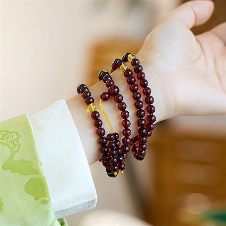 Braccialetto anti-ansia in ambra trasparente con 108 perle di Mala naturali Buddha Stones