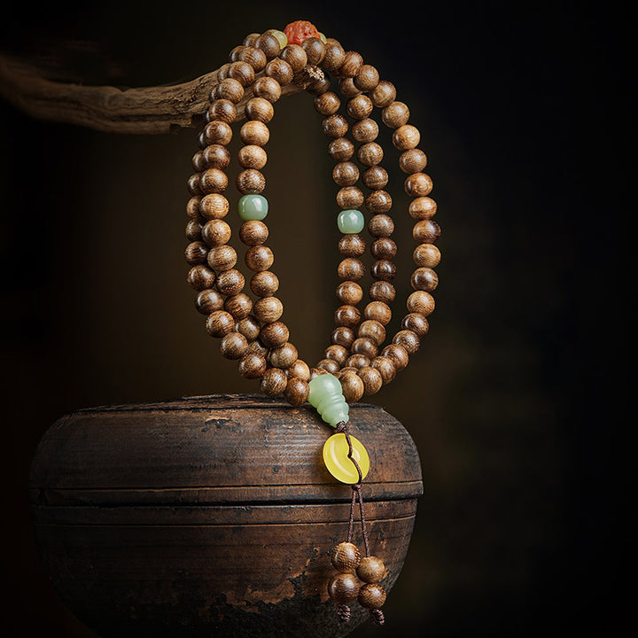 Buddha Stones 108 perle di Mala Kalimantan Agarwood Zucca Giada Ambra Bracciale equilibrio