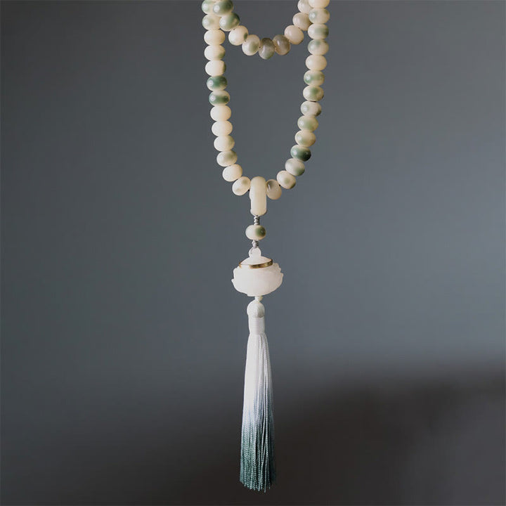 Buddha Stones naturali 108 perle Mala Bodhi Seed Lotus inciso braccialetto di saggezza nappa