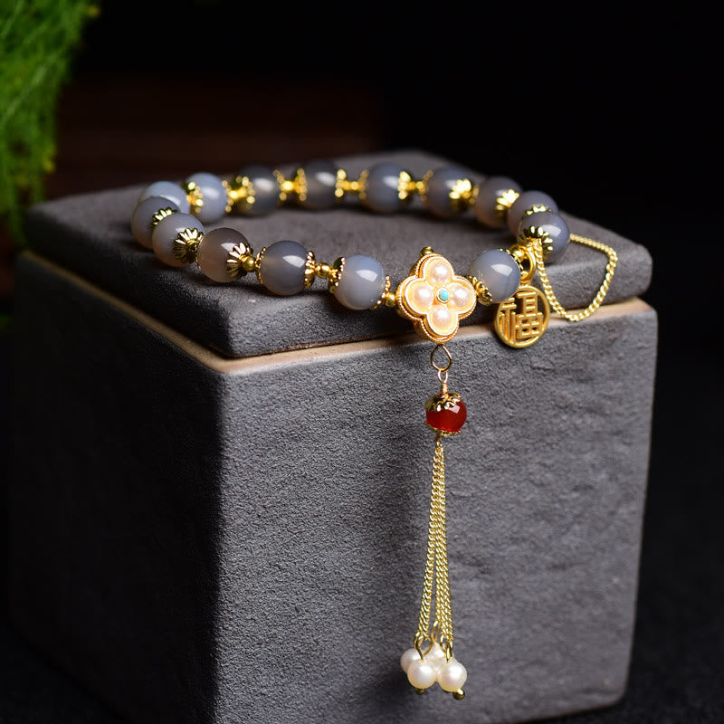 Braccialetto di equilibrio con nappa di perle di carattere Fu in agata grigia naturale Buddha Stones