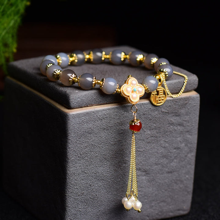 Braccialetto di equilibrio con nappa di perle di carattere Fu in agata grigia naturale Buddha Stones