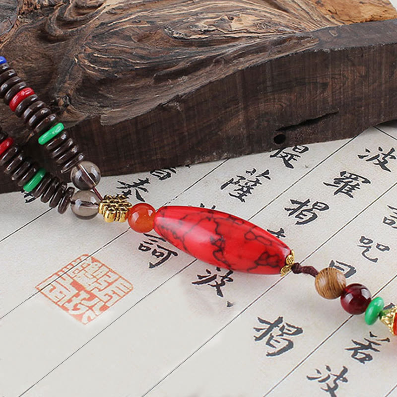 Collana con ciondolo in pietra turchese, pietra di legno di wenge, protezione e calma Buddha Stones