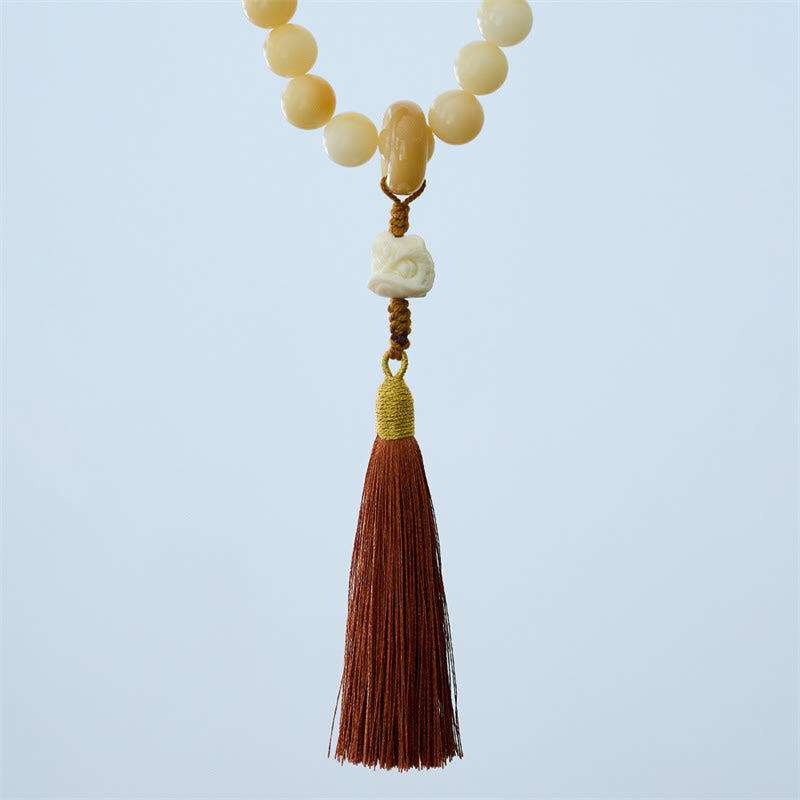 Buddha Stones Semi di Bodhi naturali Avorio Frutta Leone danzante Ciondolo Armonia Nappa Polso Mala