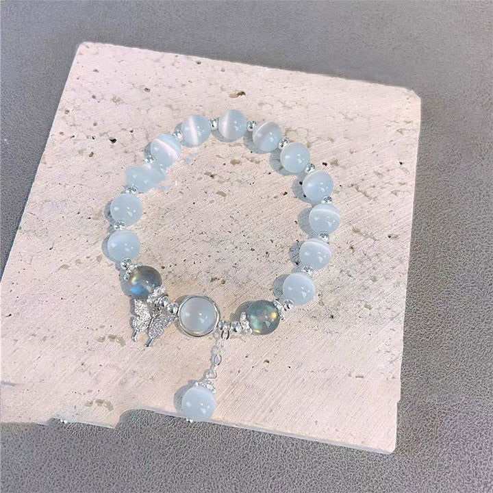 Braccialetto di supporto con ciondolo a forma di stella a forma di farfalla, pietra di luna e occhio di gatto Buddha Stones