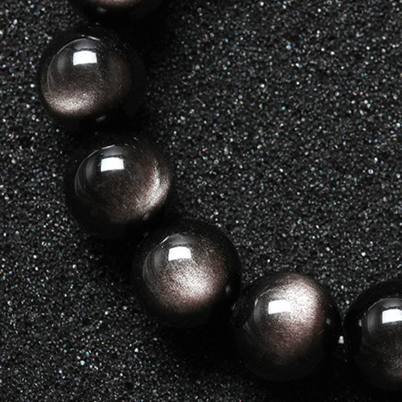 Braccialetto di protezione lenitiva in ossidiana lucida d'argento naturale Buddha Stones