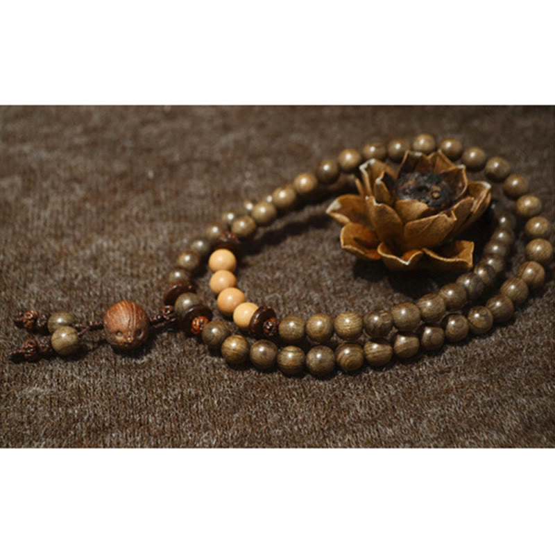 Bracciale Mala con ciondolo di protezione in legno di sandalo tibetano Buddha Stones