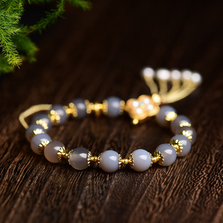 Braccialetto di equilibrio con nappa di perle di carattere Fu in agata grigia naturale Buddha Stones