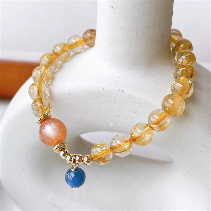 Bracciale Buddha Stones in oro naturale, quarzo rutilato, pietra del sole, cianite, ricchezza