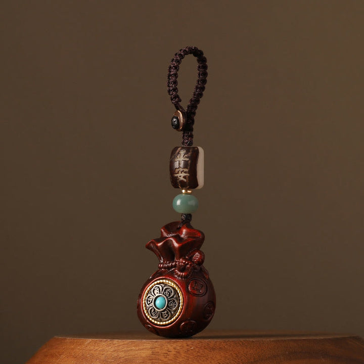 Buddha Stones Piccola foglia Sandalo rosso Sandalo verde Sacchetto di soldi Om Mani Padme Hum Protezione girevole Decorazione appesa - Sandalo rosso a foglia piccola (allontana gli spiriti maligni ♥ Protezione) - Portachiavi - image 0